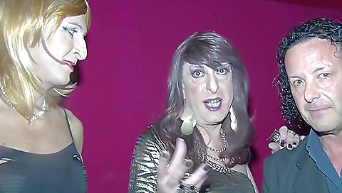 Busty shemale takes on two guys in group sex and fucks