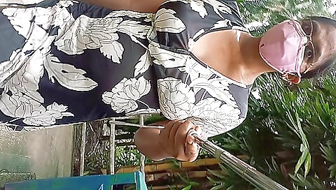 Beautiful brunette walks in the park and shows off her body