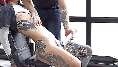 A tattooed slut is trapped in the gym and is making out with a dildo